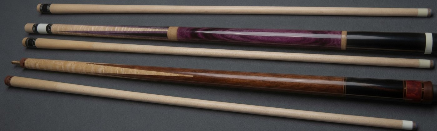 Group of five custom cues including purpleheart and bocote forearms